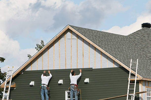 Professional Storm Damage Siding Repair technician working in Lemont Furnace, PA